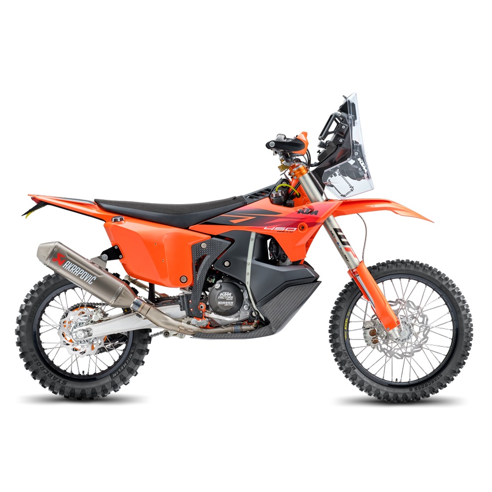 Studio side view of an orange KTM rally bike