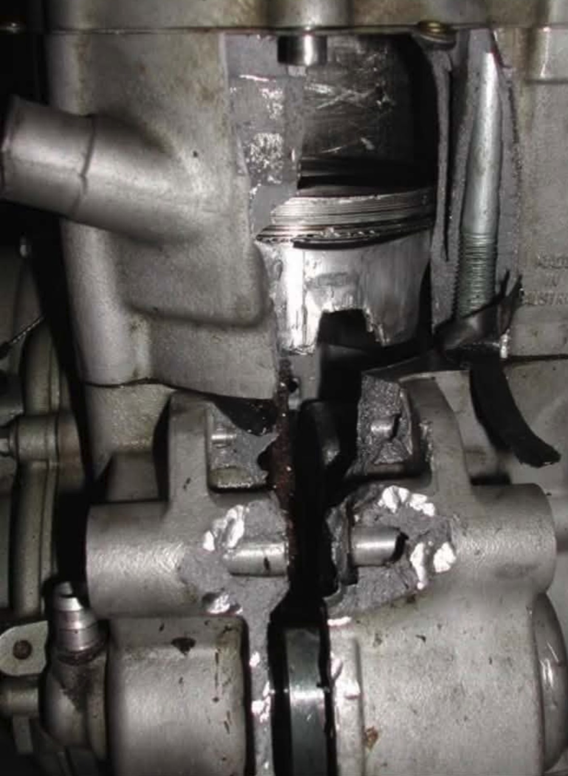 A KTM engine case broken open around the piston and connecting rod