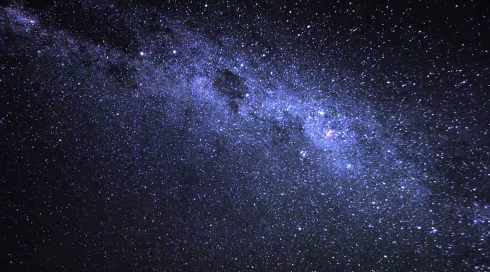 The Milky Way stretched across a dark desert sky